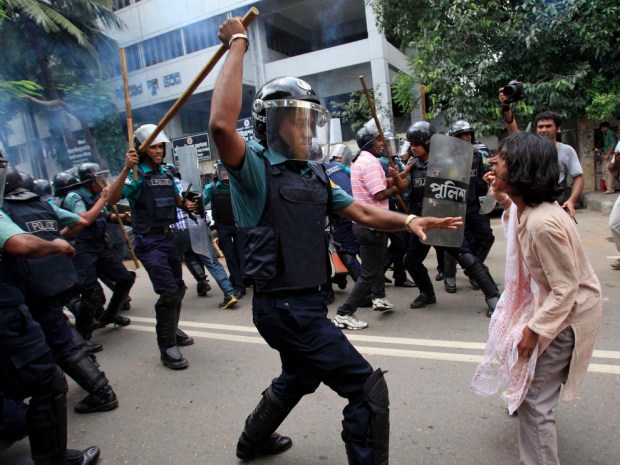 Bangladesh Riot Beating woman with baton