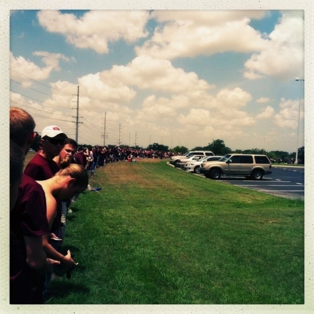 American students forming a human barricade against the WBC at a soldier's funeral.