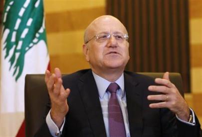 Lebanon's Prime Minister Najib Mikati talks at the Grand Serail, the government headquarters in Beirut